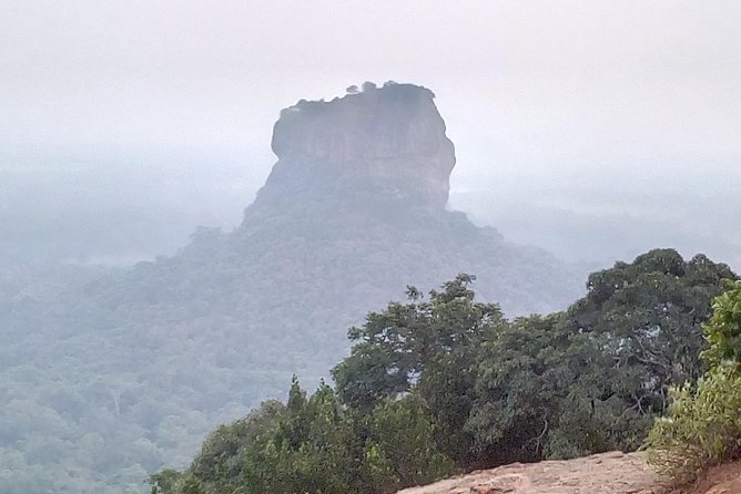 All inclusive Private day trip Sigiriya and Dambulla caves with more - Entering Dambulla’s gilded cave temple